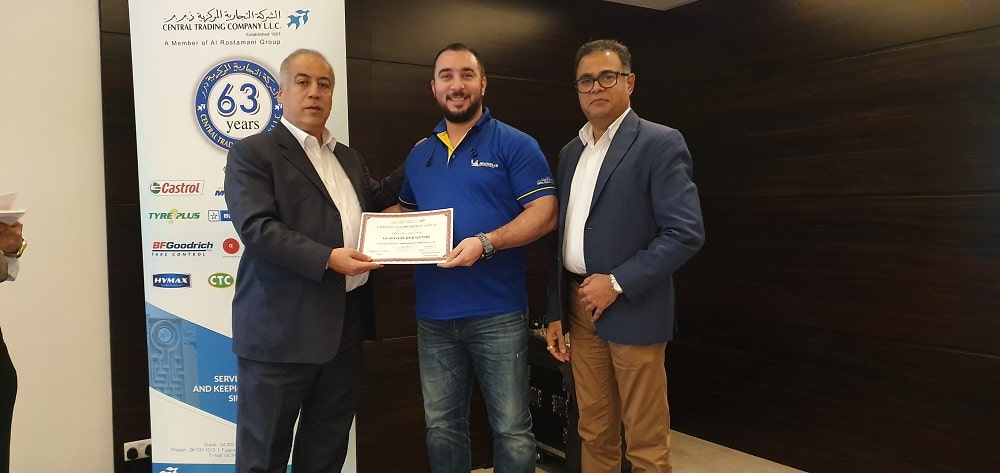 Man in blue shirt smile on having Achievement Certificates