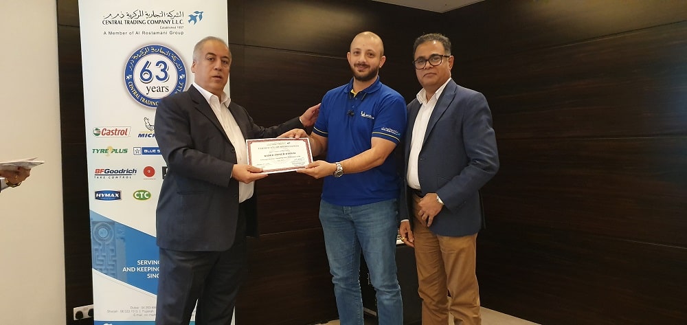 Man in blue shirt smile on having Achievement Certificates