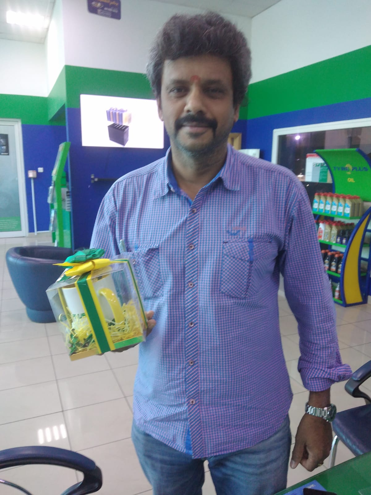 Indian man with Diwali gift in Dubai