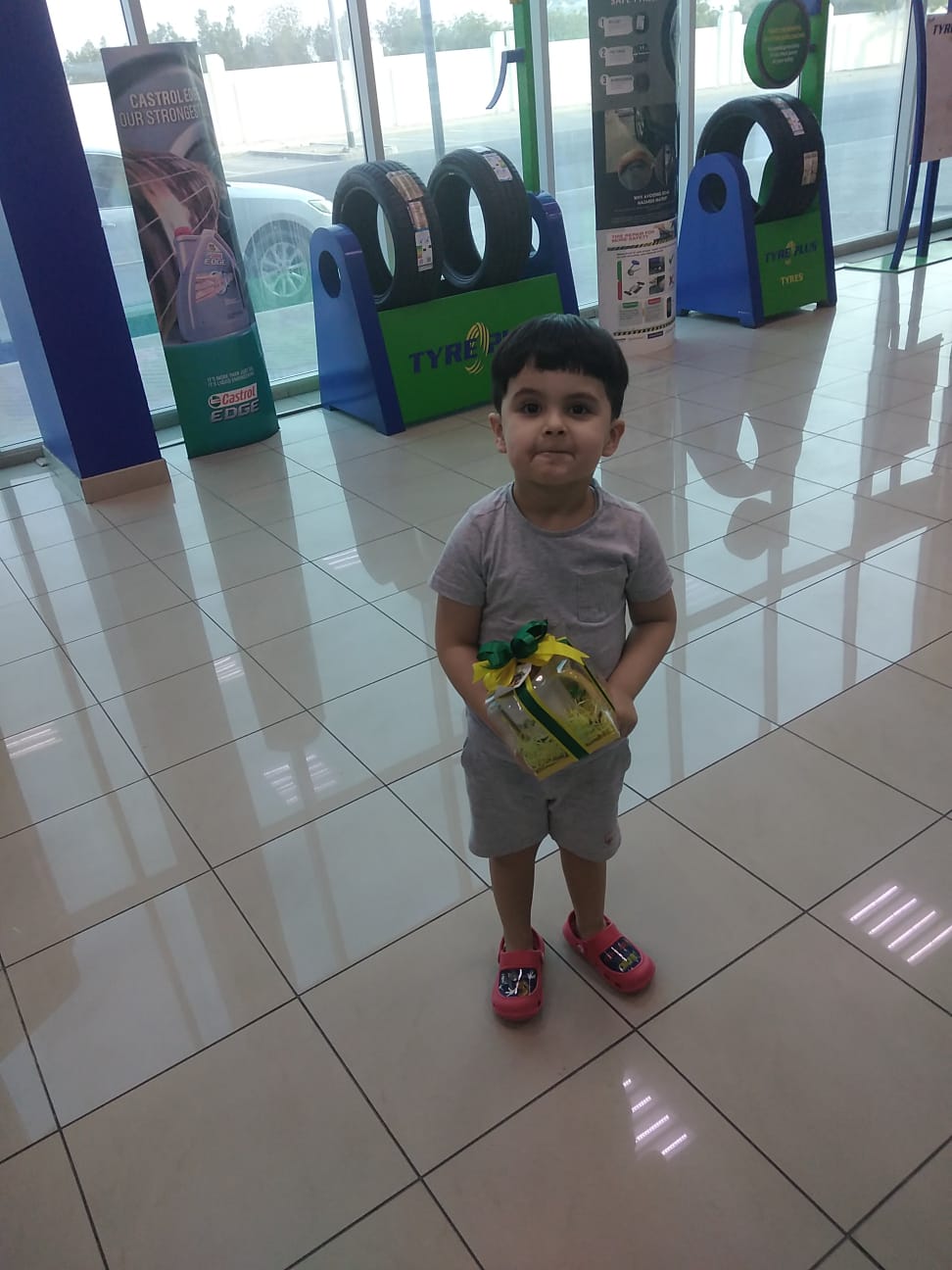 Cute baby Boy in tyre shop Dubai