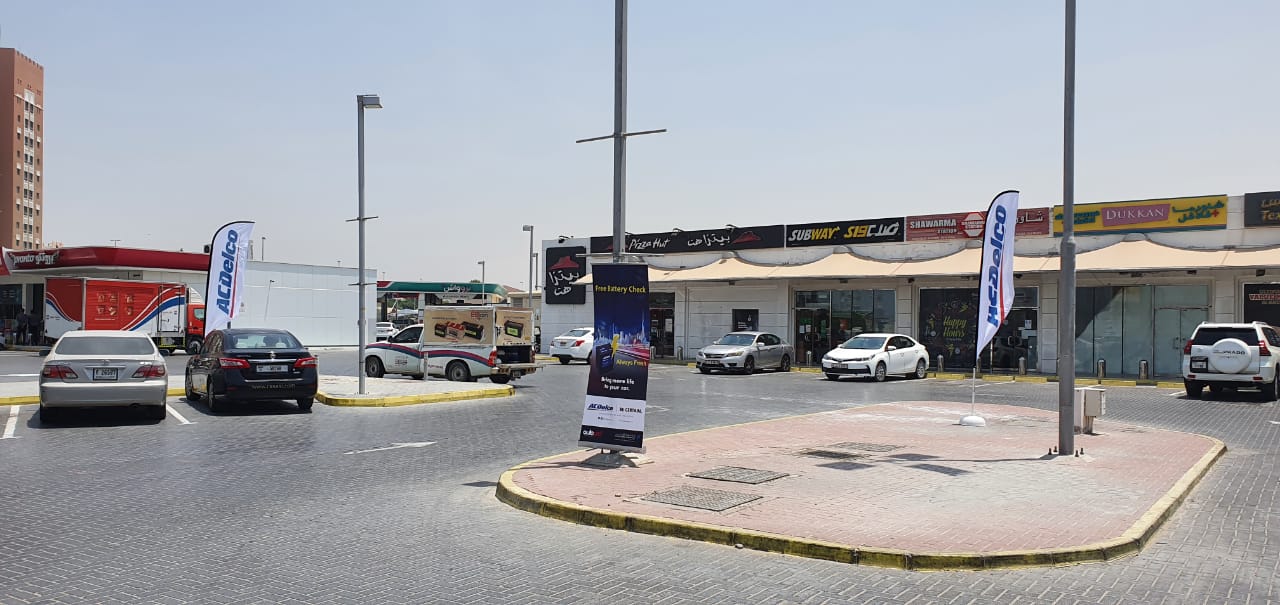 ACDelco banners in front of Subway and Pizza Hut