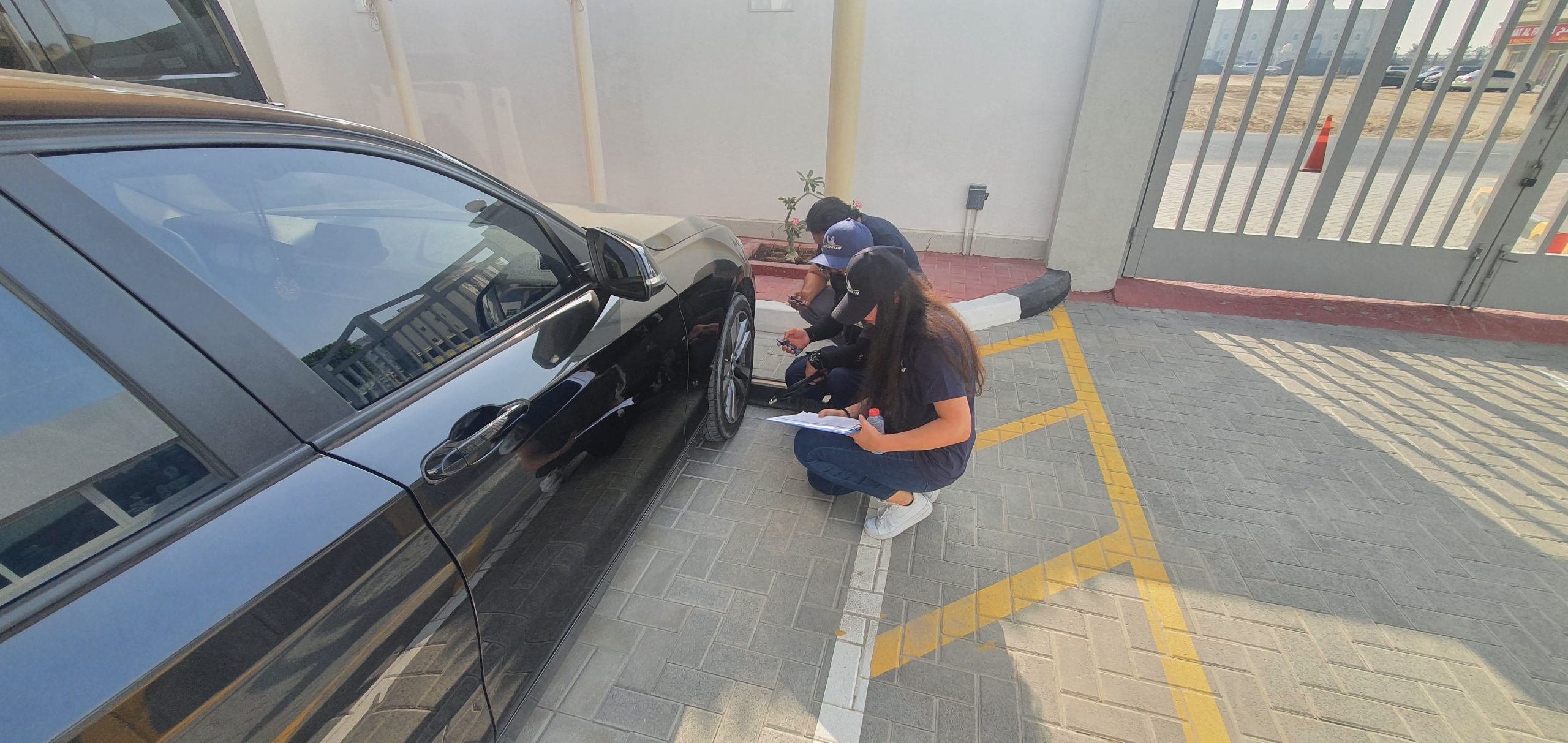 Tire specialists checking tire pressure