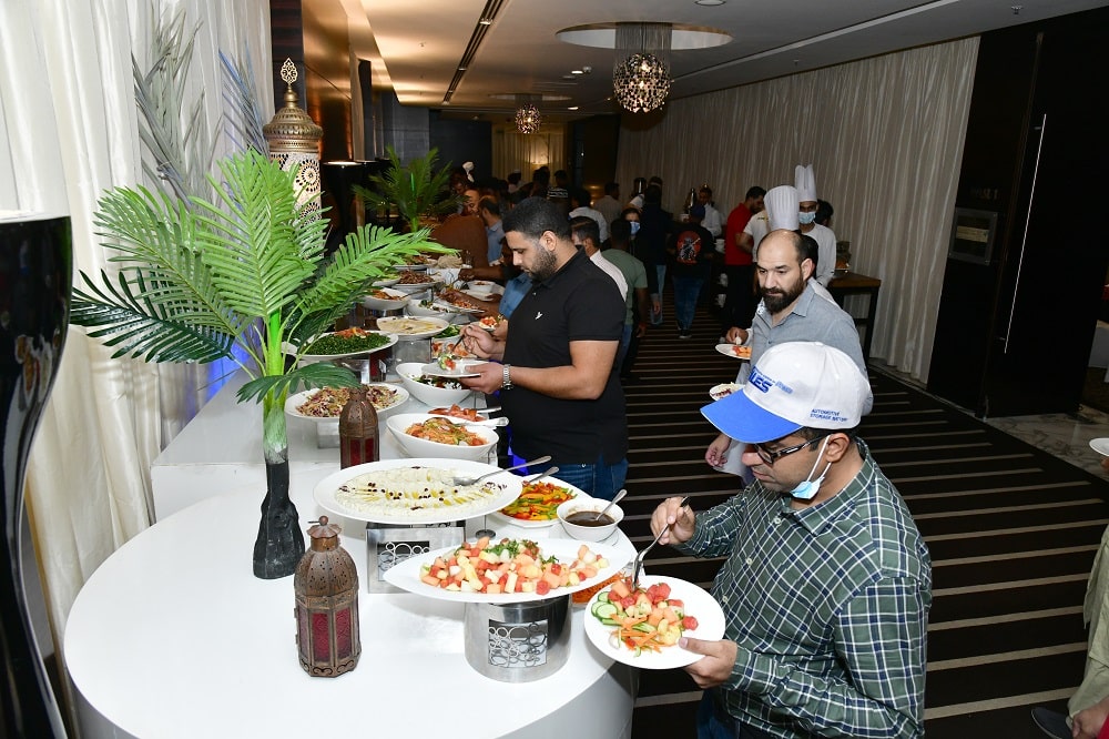 Decorative plant and lantern give more life to the food table