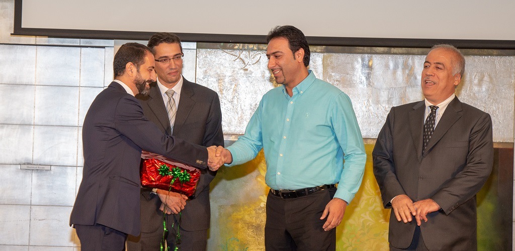 Man smiling on receiving gift of appreciation