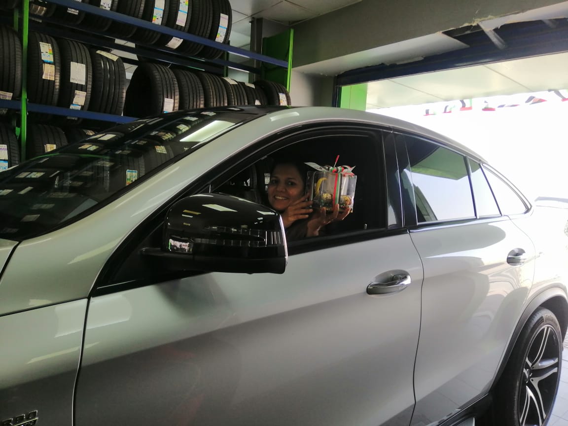 Silver car in Tyreplus service station