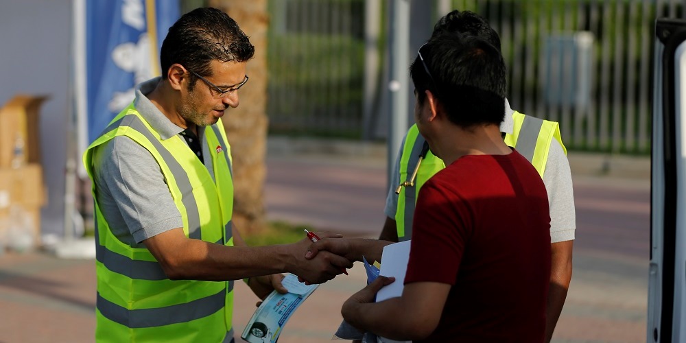 Satisfied Michelin customer shake hands with the mechanic