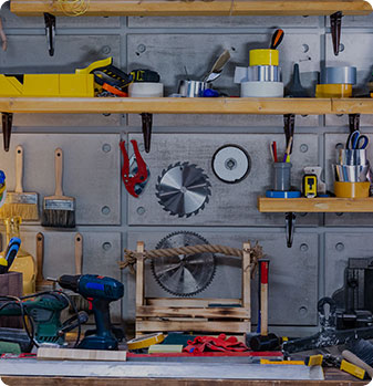 Multiple Garage tools on wall and shelf