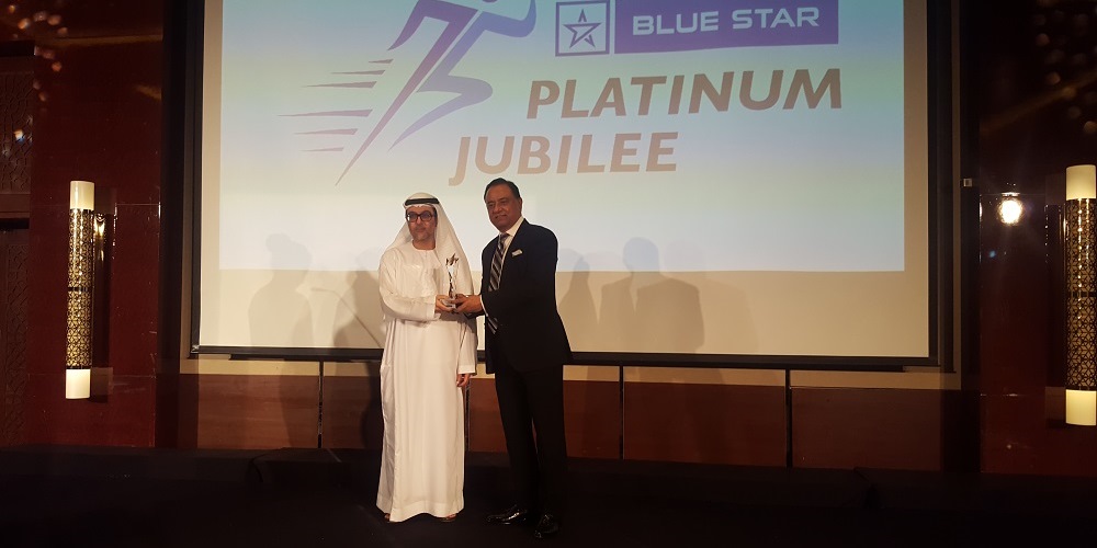 Mr. Hassan Abdulla Al Rostamani giving Award